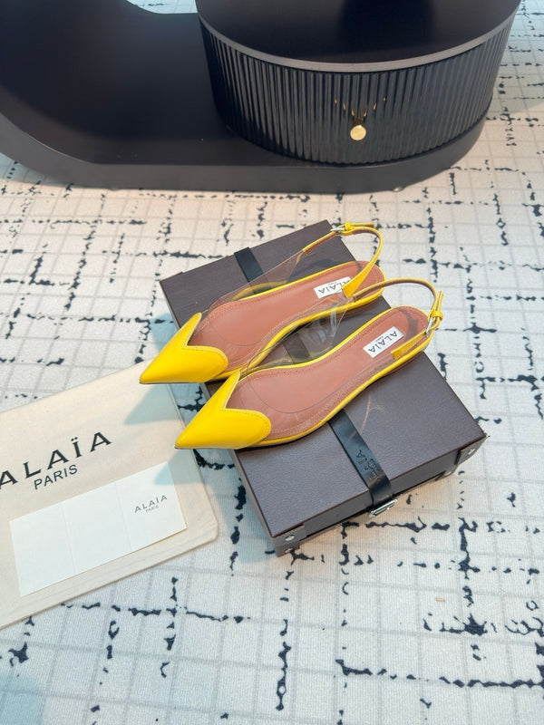 ALAIA FLAT SLINGBACK IN YELLOW PATENT CALFSKIN AND FILM