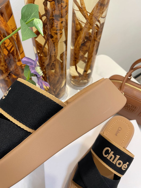 CHLOÉ WOODY WEDGE SANDALS IN BLACK CANVAS WITH CIDER BROWN RUBBER SOLE