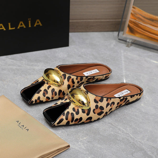 ALAIA FLAT MULE IN LEOPARD LAMBSKIN WITH GOLD HARDWARE